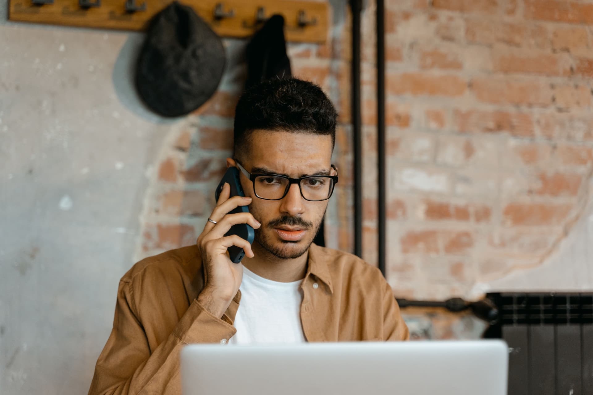 A tenant on the phone looking concerned, calling after hours