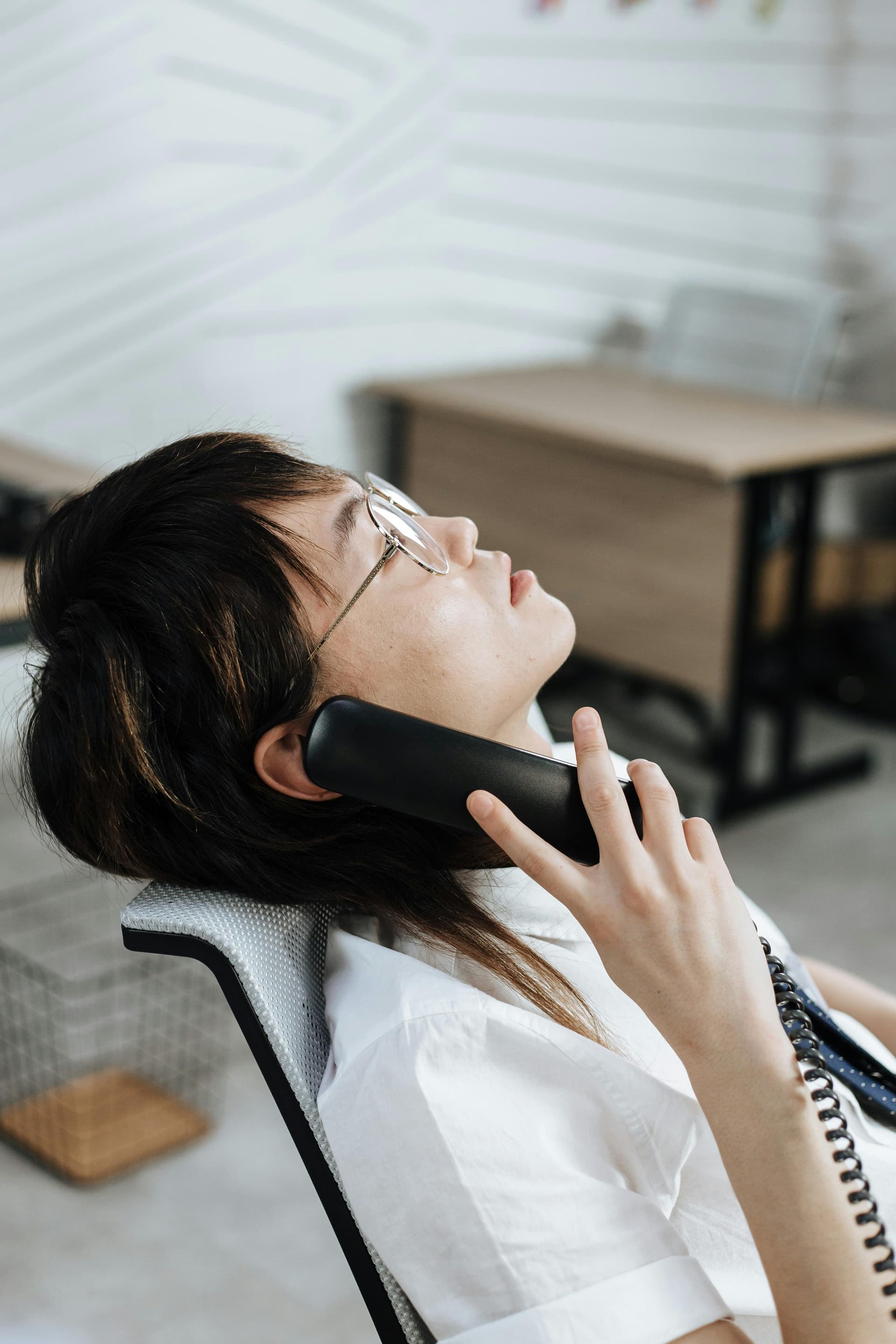 Call center agent with headset taking a message